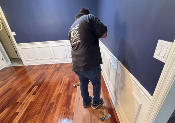 Hard at work polishing hardwood flooring