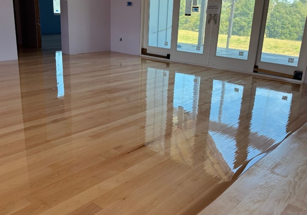 Process of refinishing a hardwood floor