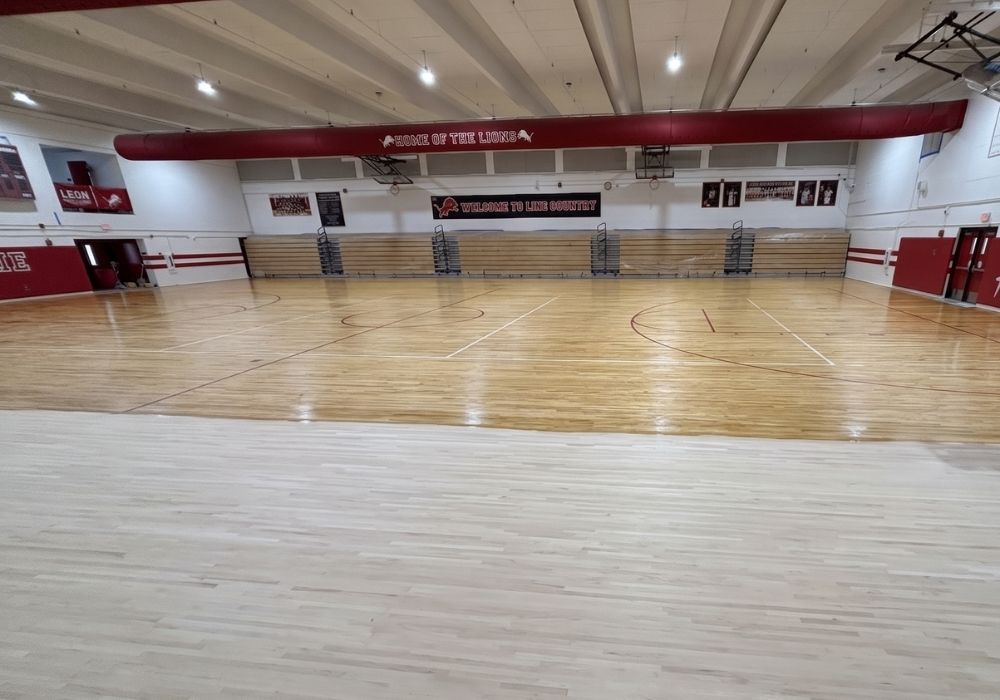 Refinishing hardwood flooring in a gym