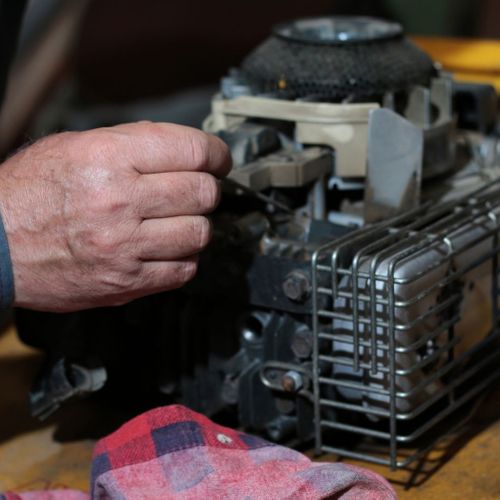 mechanic working on a motor