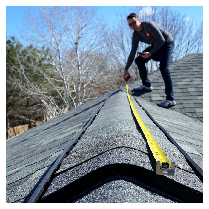 a person measuring their roof Preventive Tips.jpg