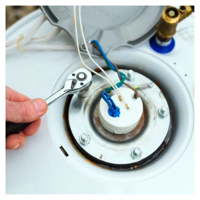 A worker repairing a water heater Our Top Tips for Extending the Lifespan of Your Water Heater 4.jpg