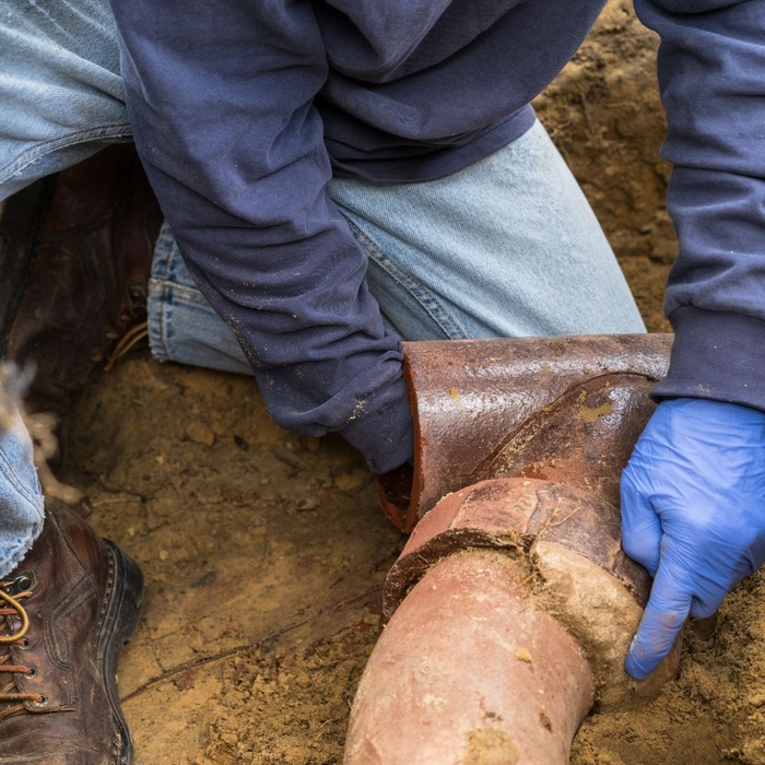 plumber working on main sewer line plumber working on main sewer line