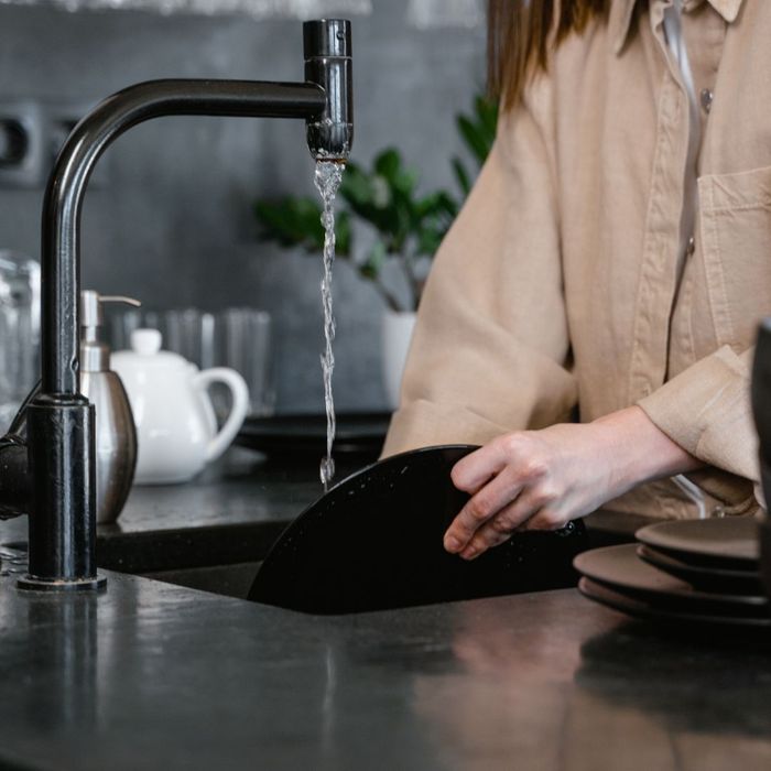 washing dishes in sink