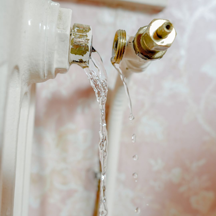 Burst Pipe Leaking Water Onto Floor