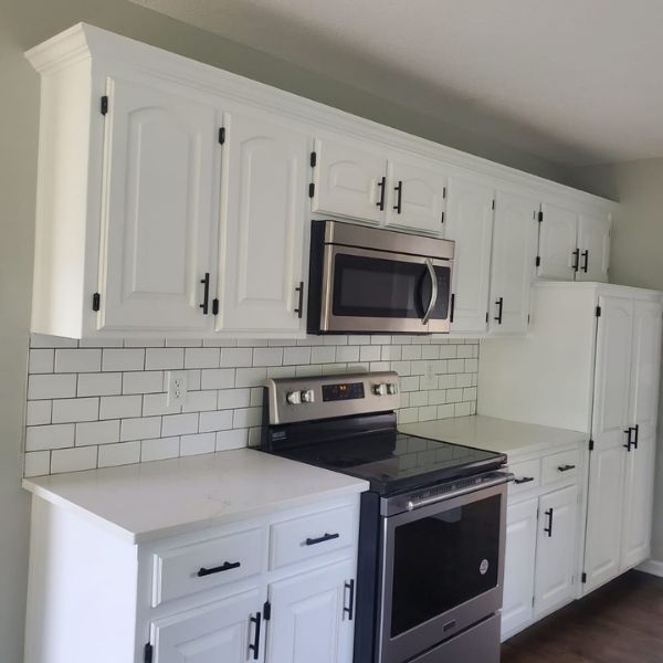 remodeled kitchen with white cabinets