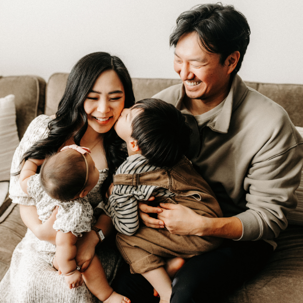 Parents with two young kids.