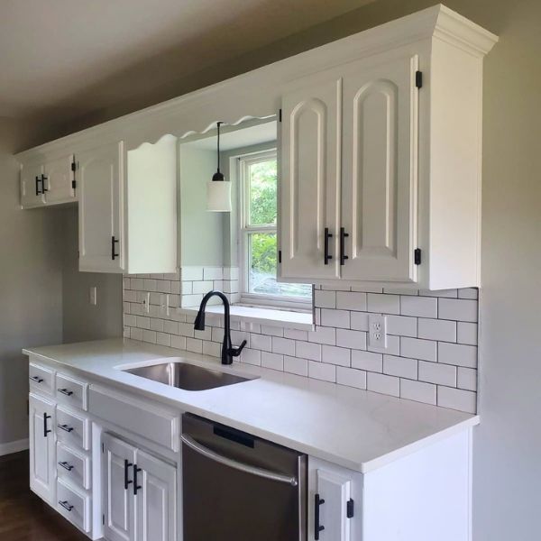 remodeled kitchen with white cabinets