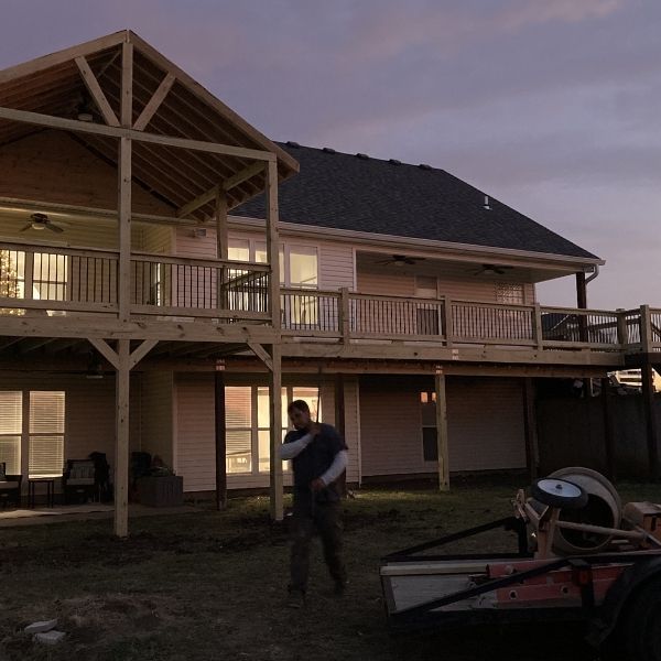 outside of deck with worker in the backyard