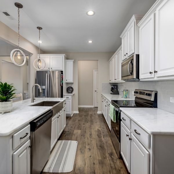 newly renovated kitchen with white cabinets