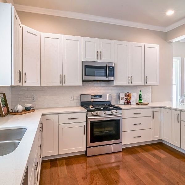 remodeled kitchen with white cabinets