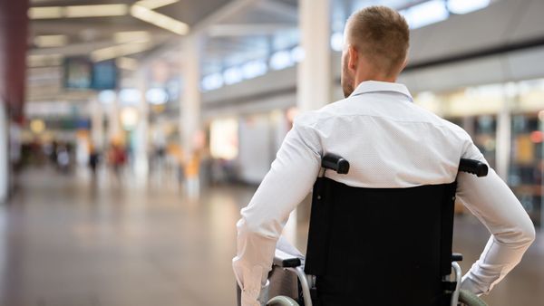 man in a wheelchair at the airport