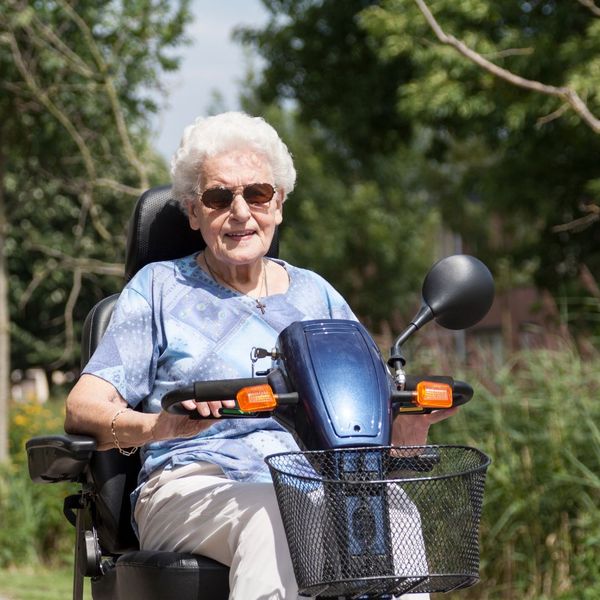 older woman on an electric scooter