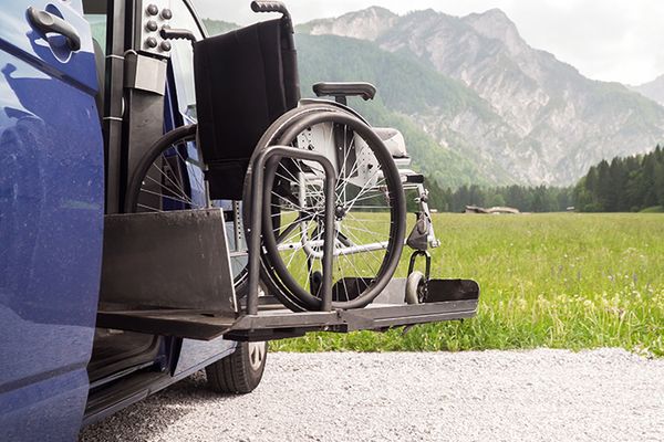 Wheelchair on a ramp with mountains in the background