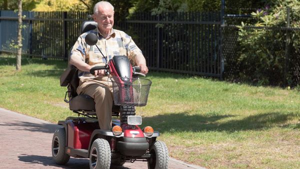 older man on an electric scooter