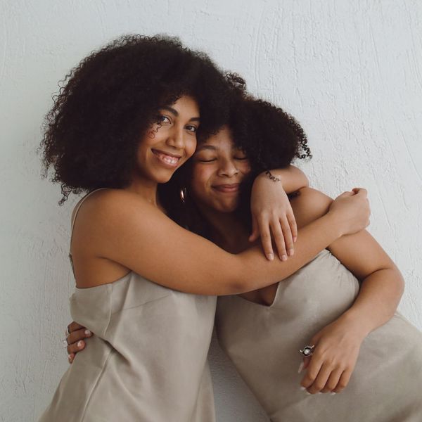 two female friends hugging each other