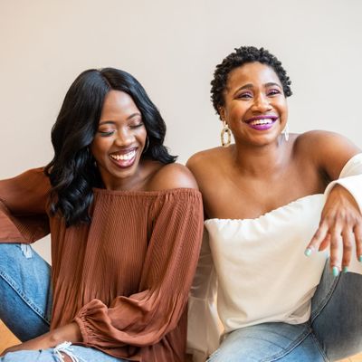 two female friends smiling