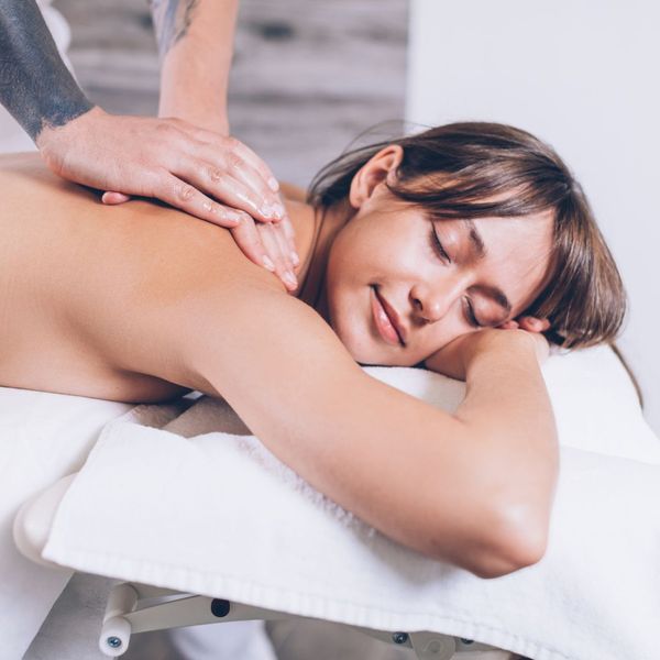 Woman relaxing while getting a massage