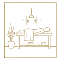 A gold line-art icon of a massage table in a room with a potted plant, an overhead lamp, and sound-wave symbols representing a quiet, peaceful atmosphere.