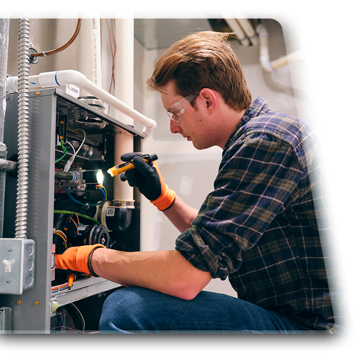 Photo of a man working on an HVAC system