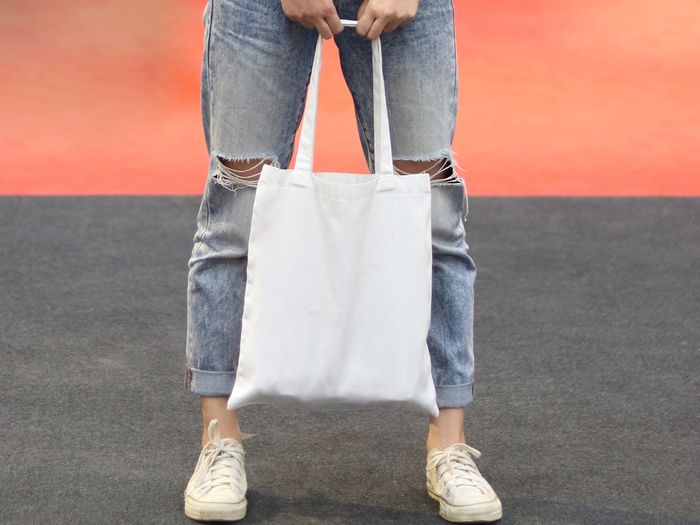Woman holding tote bag