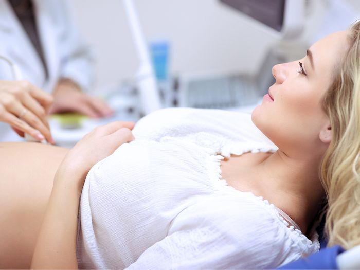 Woman getting an ultrasound in a doctors office