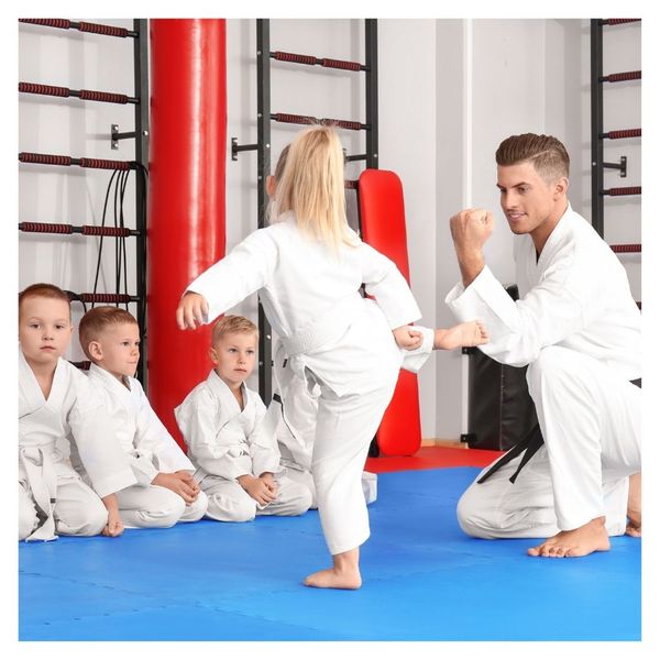 kids doing karate with teacher