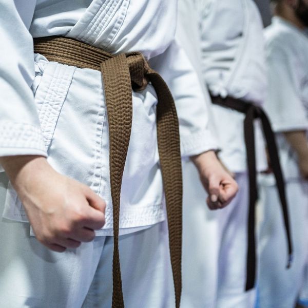 karate students standing with fists clenched