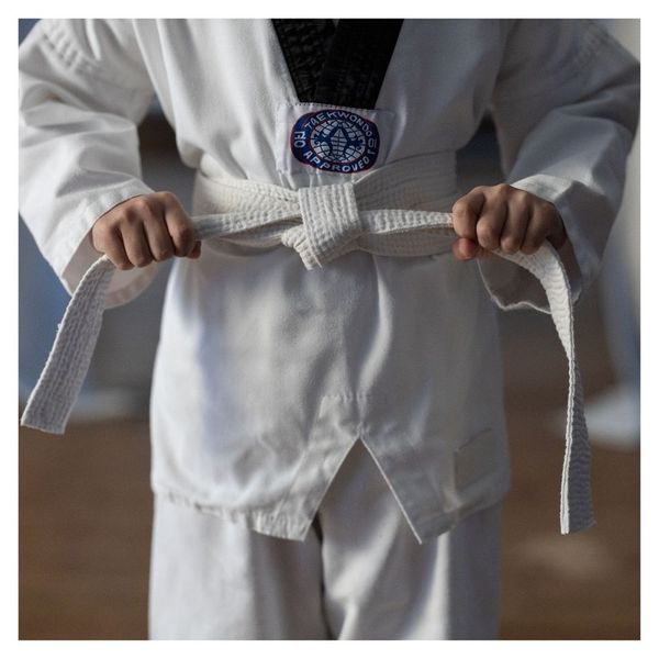 kids putting on white belt