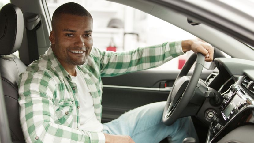 man in car