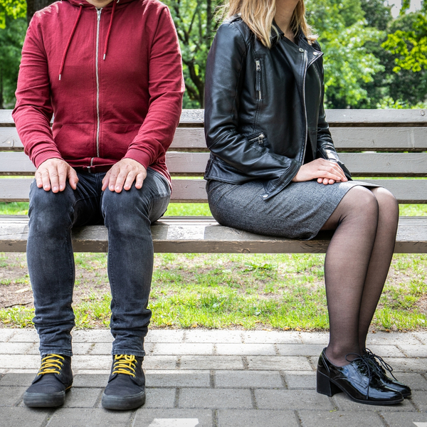 Woman sitting away from a man