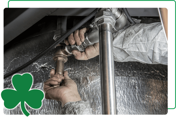 plumber working on pipes