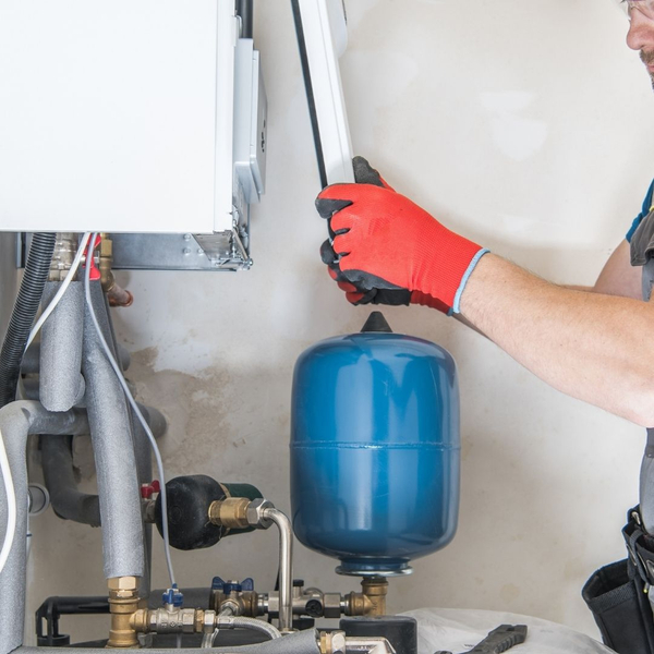 tech working on a heating system