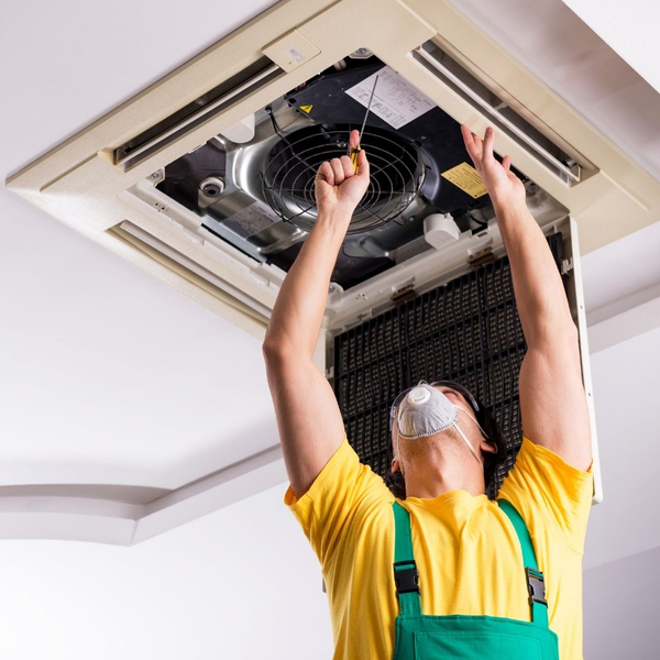 HVAC tech inspecting a system