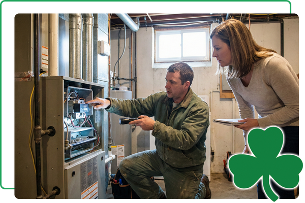 Technician inspecting a residential furnace