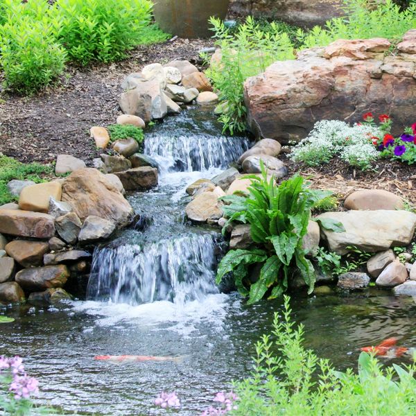 water feature hardscaping in the back yard of a home