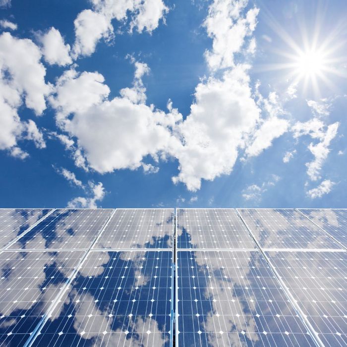 solar panels reflecting cloudy sky solar panels reflecting cloudy sky