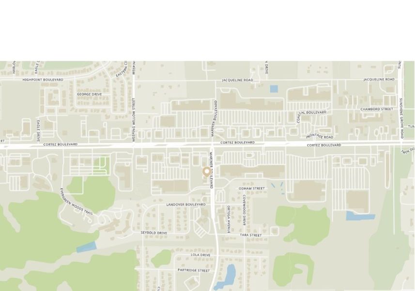 A light-colored map showing the street layout and geographical features of the Spring Hill area, highlighting major roads like Mariner Boulevard and Cortez Boulevard, with residential areas and green spaces.