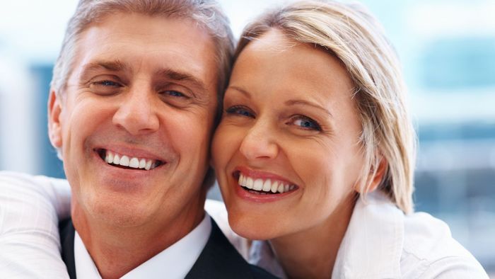middle aged couple with restored teeth