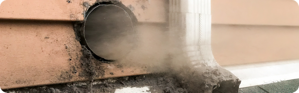 blowing out dryer vent opening on side of house