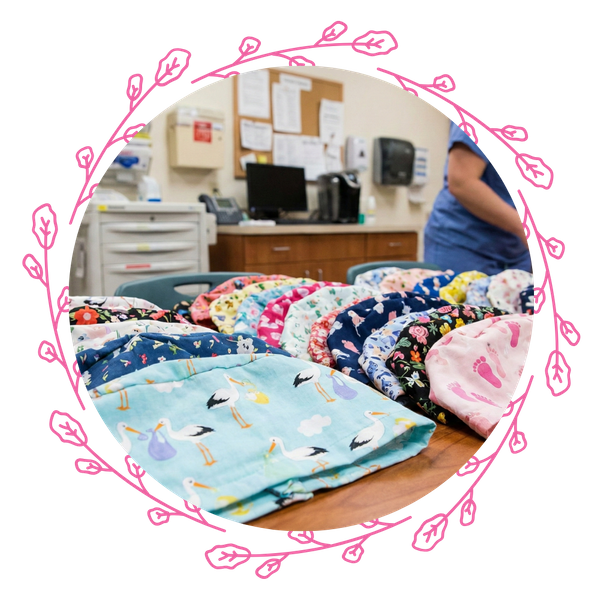 A variety of colorful Labor & Delivery scrub caps displayed in a hospital setting.
