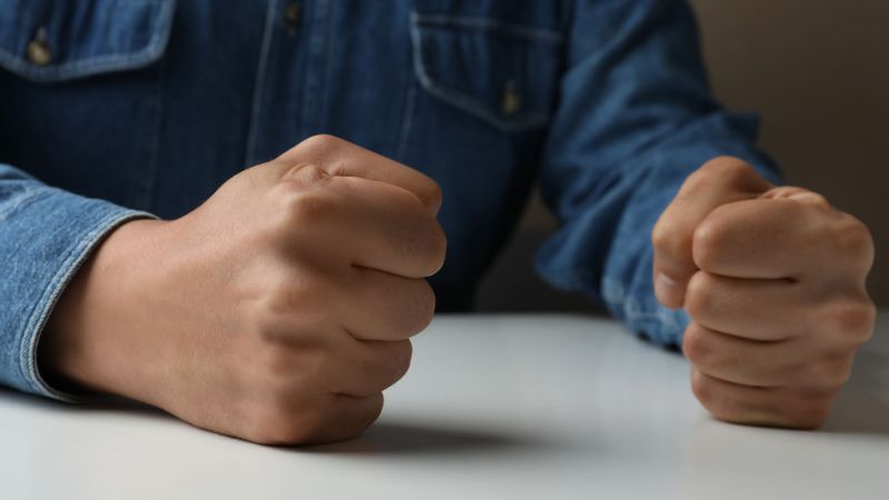 man with angry fists