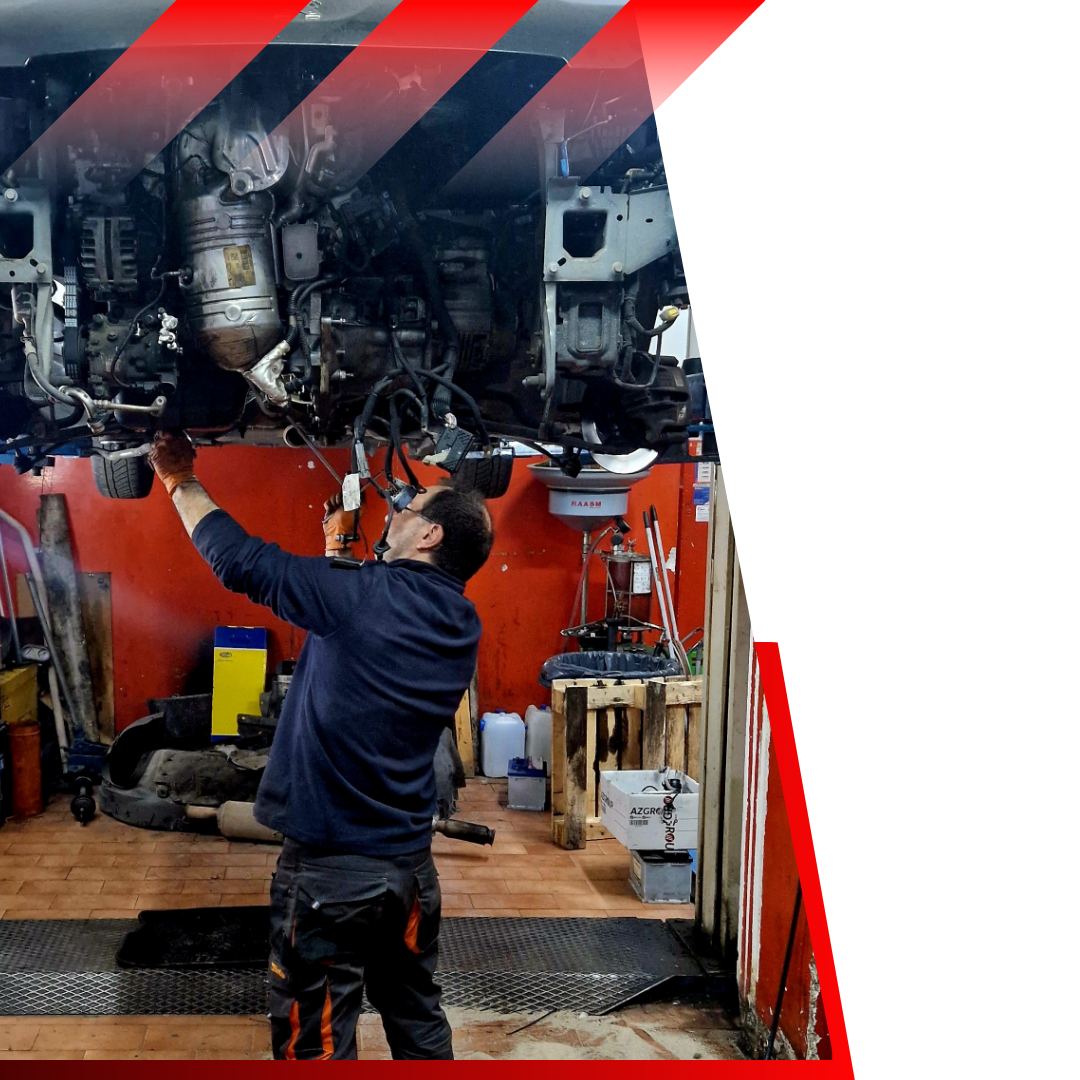 mechanic working on car on lift 