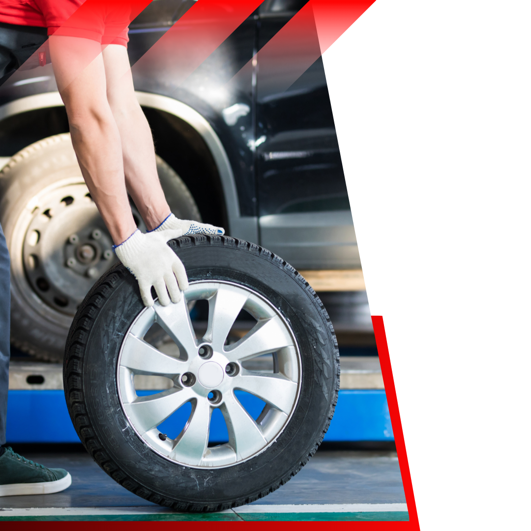 person rolling a new tire 