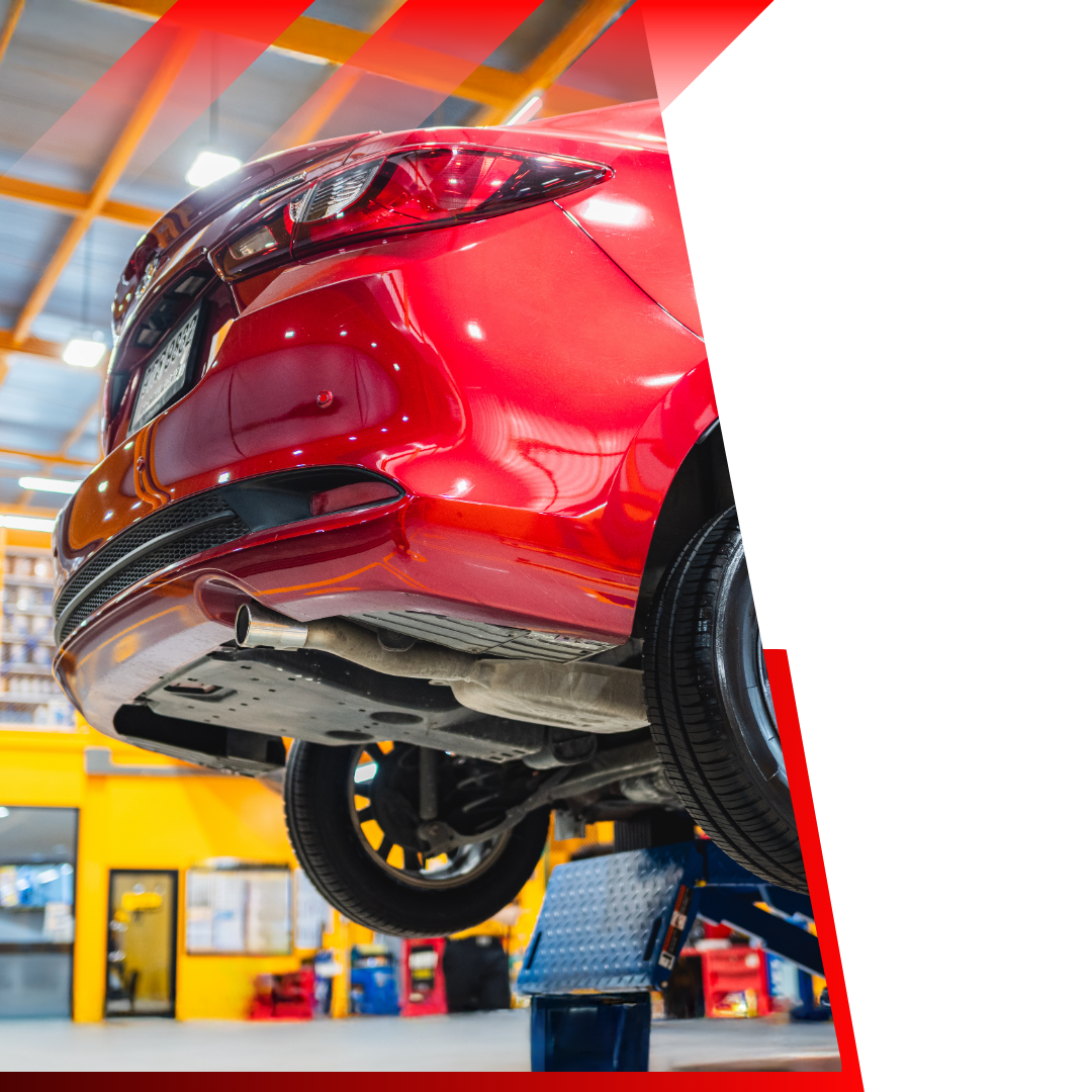 red car on lift 