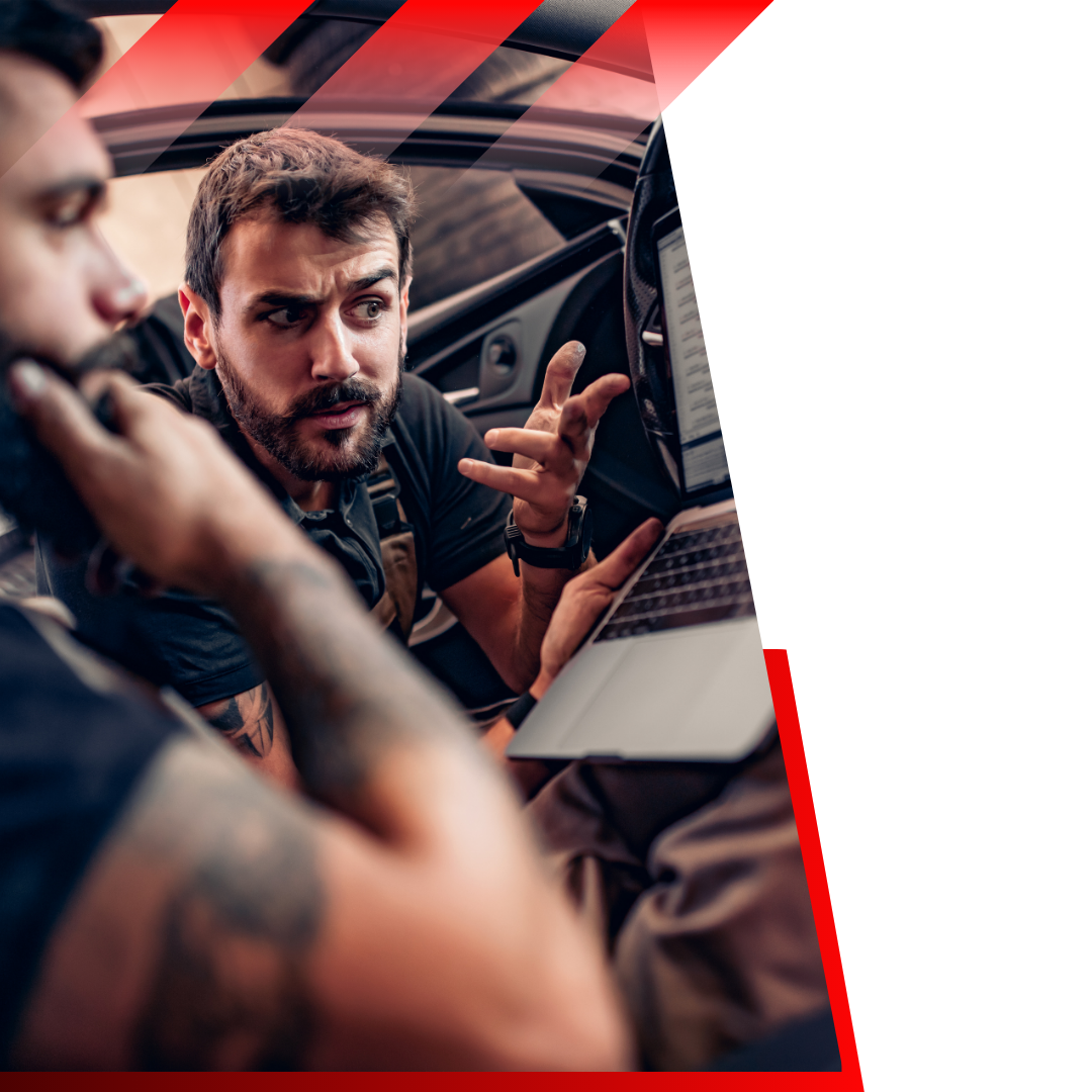 mechanics discussing codes that popped on a computer 