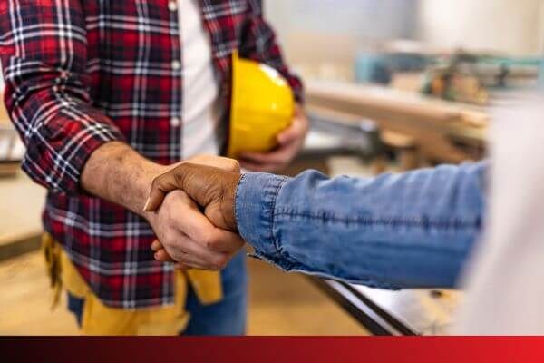 contractor shaking hands with homeowner