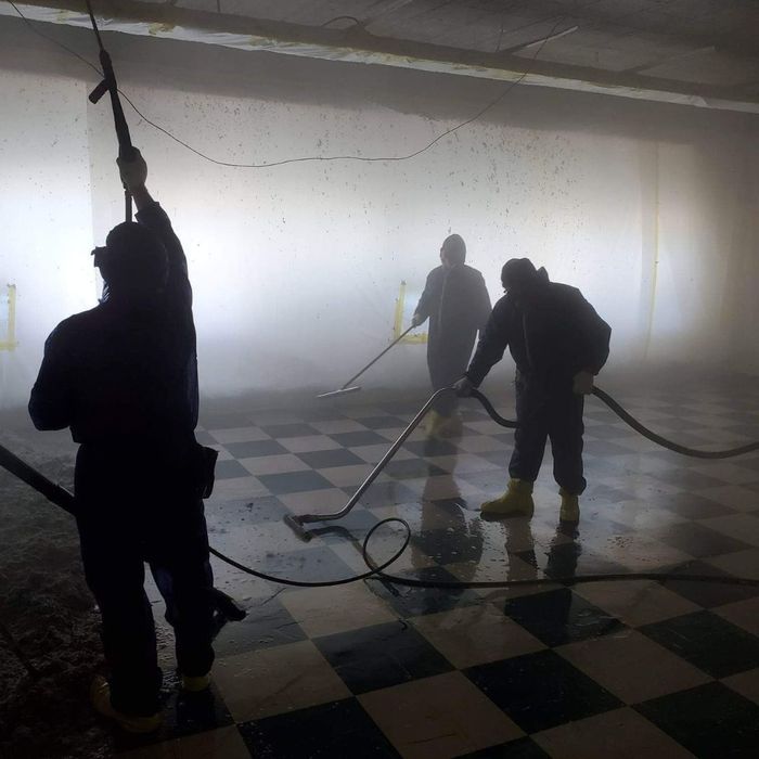 3 men spraying for asbestos 3 men spraying for asbestos