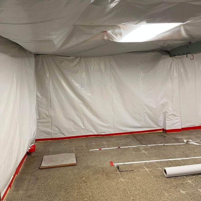 a room that is taped with plastic during asbestos abatement a room that is taped with plastic during asbestos abatement