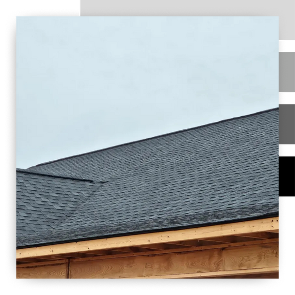 dark shingle roof on wood house frame